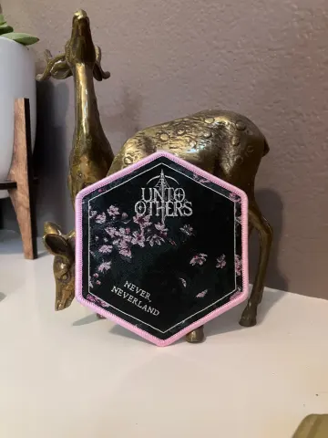 Official Unto Others - “Never, Neverland”